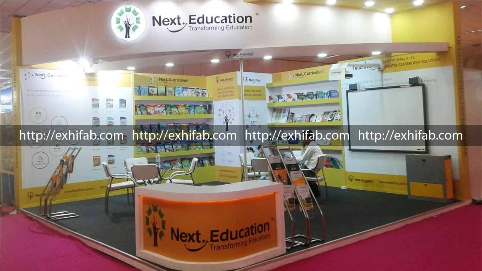Custom exhibition stall for Next Education featuring interactive EdTech displays